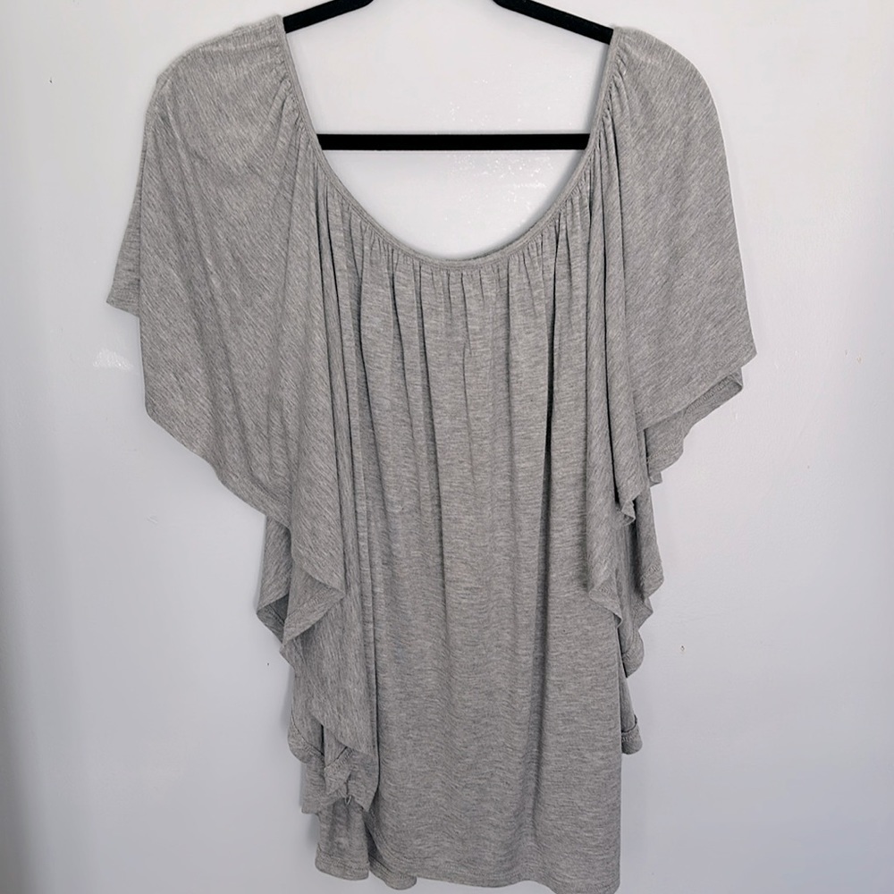 Adorable flutter bat wing jersey top. No tags